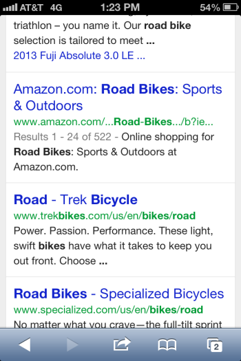 Google's new mobile interface displays organic content below paid ads.